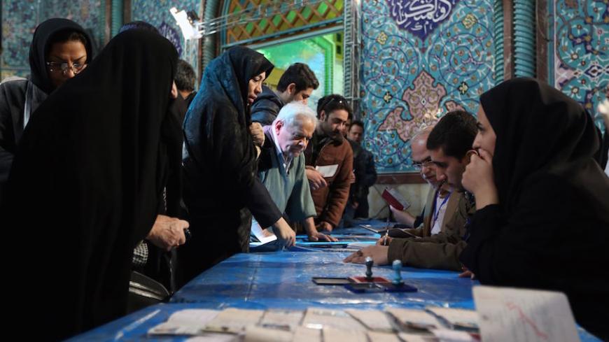 Iranian voters queue to cast their vote for both parliamentary elections and the Assembly of Experts at polling station in Tehran on February 26, 2016.


Iranians began voting across the country in elections billed by the moderate president as vital to curbing conservative dominance in parliament and speeding up domestic reforms after a nuclear deal with world powers. / AFP / ATTA KENARE        (Photo credit should read ATTA KENARE/AFP/Getty Images)