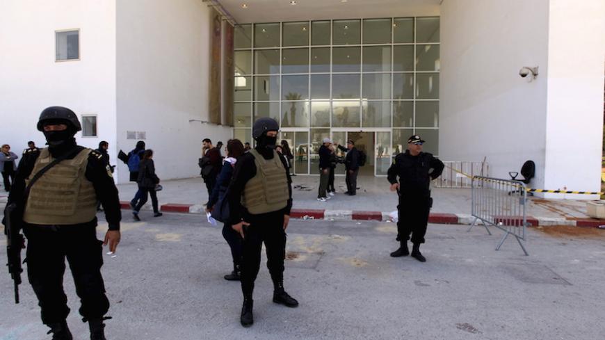 Tunisian police officers guard the entrance of the National Bardo Museum in Tunis March 19, 2015. Tunisia said it would deploy the army to major cities and arrested four people on Thursday after militant gunmen killed 20 foreign tourists visiting the national Bardo museum, the worst attack on the north African country in more than a decade. REUTERS/Anis Mili - RTR4U1T3