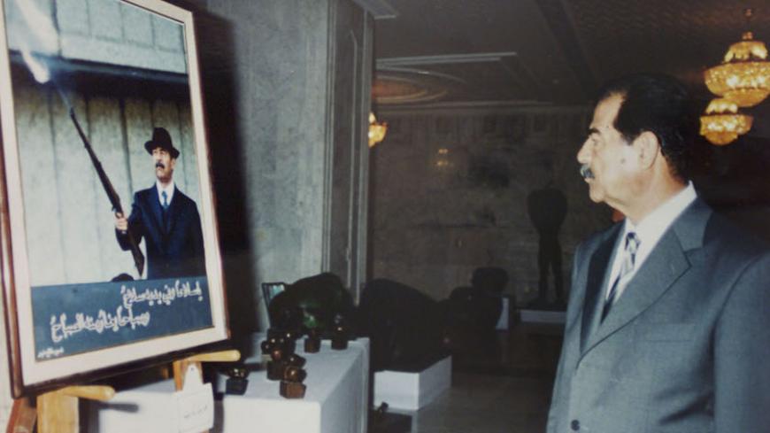 Iraqi president Saddam Hussein admires a photograph of himself, presented to him by the Iraqi Information Ministry during an exhibition of gifts June 2001, presented to the Iraqi president for his birthday on April 28 2001. Picture taken June 2001.

fk/AA - RTRJZ1U