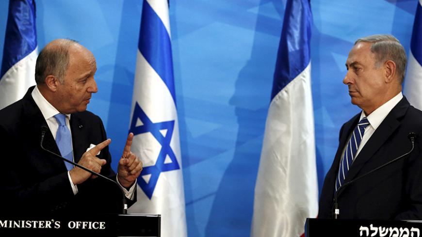 Israel's Prime Minister Benjamin Netanyahu (R) and France's Foreign Minister Laurent Fabius deliver statements in Jerusalem June 21, 2015. Netanyahu prefaced talks about a French-led peace initiative on Sunday by saying foreign powers were trying to dictate to Israel a deal with the Palestinians. Fabius is promoting a French-led initiative that would see the Israeli-Palestinian peace process, which collapsed in 2014, relaunched through an international support group comprising Arab states, the European Unio