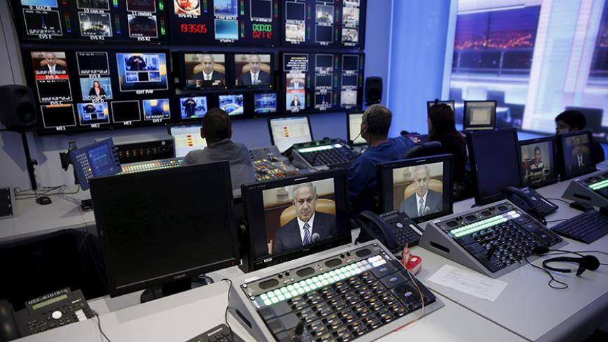 Israel's Prime Minister Benjamin Netanyahu is seen on monitors before the evening news bulletin at Channel 10's control room in Jerusalem November 18, 2015. Critics say Netanyahu, known as "Bibi," is hitting the wrong note when it comes to the media, weakening press freedom and holding sway over TV broadcasters in a country that bills itself as the Middle East's only true democracy. Picture taken November 18, 2015. To match Insight ISRAEL-NETANYAHU/MEDIA REUTERS/Ronen Zvulun  - RTX1VG2J