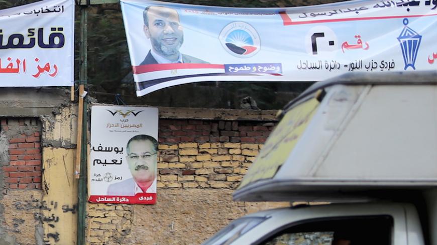 Electoral banners for the Salafist political party "al-Nour" (top) are seen in Shubra area in Cairo during the second day of the second round of Egypt's parliamentary elections, Egypt, November 23, 2015. REUTERS/Mohamed Abd El Ghany - RTX1VH3O