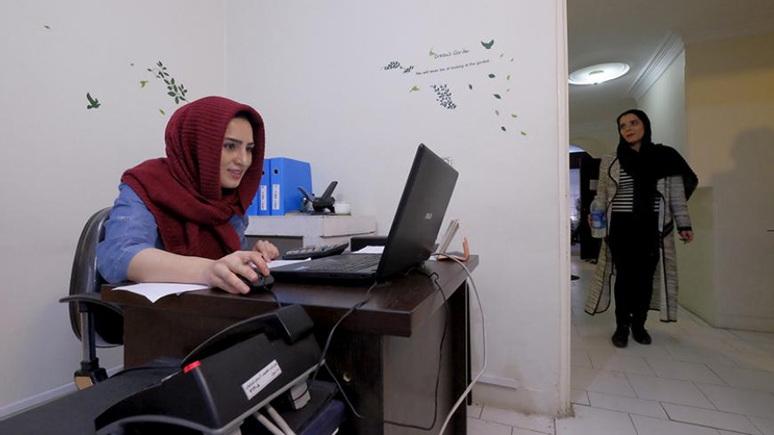 An employee works with her laptop at Takhfifan company in Tehran, Iran, January 19, 2016. REUTERS/Raheb Homavandi/TIMA  ATTENTION EDITORS - THIS IMAGE WAS PROVIDED BY A THIRD PARTY. FOR EDITORIAL USE ONLY.   - RTX2330Q