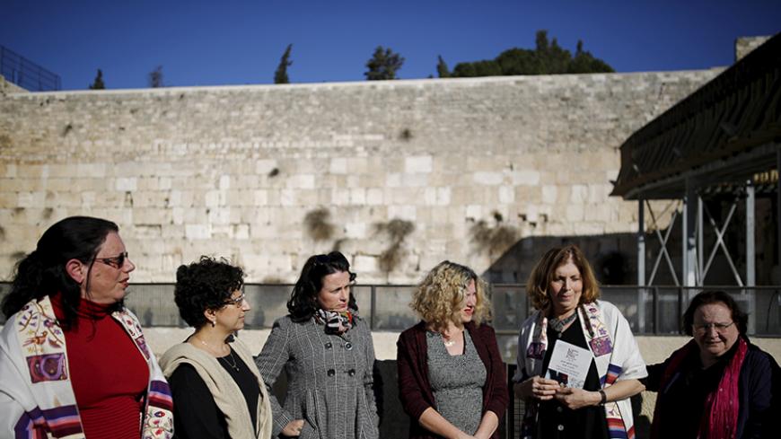 Members of activist group "Women of the Wall" speak to the media following the Israeli government's approval to create a mixed-sex prayer plaza near Jerusalem's Western Wall to accommodate Jews who contest Orthodox curbs on worship by women at the site, in Jerusalem's Old City January 31, 2016. REUTERS/Amir Cohen  - RTX24SM9