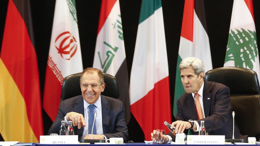 U.S. Foreign Secretary John Kerry and Russian Foreign Minister Sergei Lavrov (L) attend the International Syria Support Group (ISSG) meeting in Munich, Germany, February 11, 2016, together with members of the Syrian opposition and other officials. REUTERS/Michael Dalder - RTX26J5J