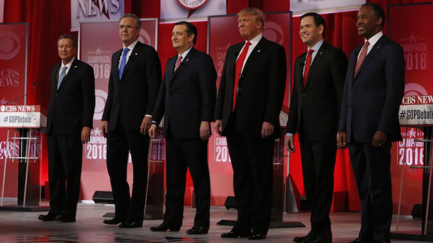 The remaining Republican U.S. presidential candidates, (L-R) Governor John Kasich, former Governor Jeb Bush, Senator Ted Cruz, businessman Donald Trump, Senator Marco Rubio and Dr. Ben Carson pose before the start of the Republican U.S. presidential candidates debate sponsored by CBS News and the Republican National Committee in Greenville, South Carolina February 13, 2016. REUTERS/Jonathan Ernst  - RTX26TL7