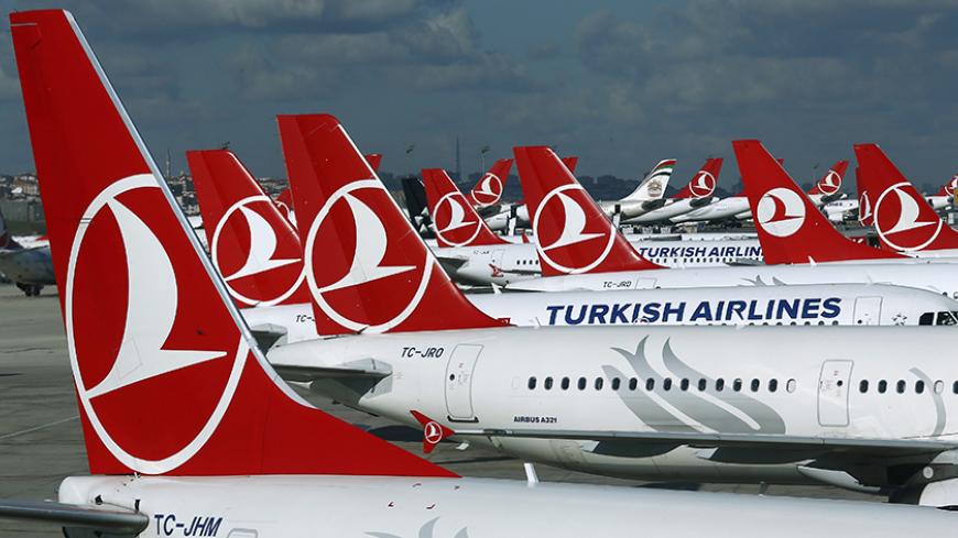 Turkish Airlines aircrafts are parked at the Ataturk International airport in Istanbul, Turkey December 3, 2015. Turkish Airlines, Europe's fourth biggest carrier, said the number of its passengers rose 8.1 year-on-year in January to 4.7 million. In a statement to the Istanbul stock exchange on Tuesday evening February 16, 2016, it said load factor, which measures an airline's capacity utilisation, declined by 2.2 percentage points to 74.2. Picture taken December 3, 2015. REUTERS/Murad Sezer  - RTX27BA3