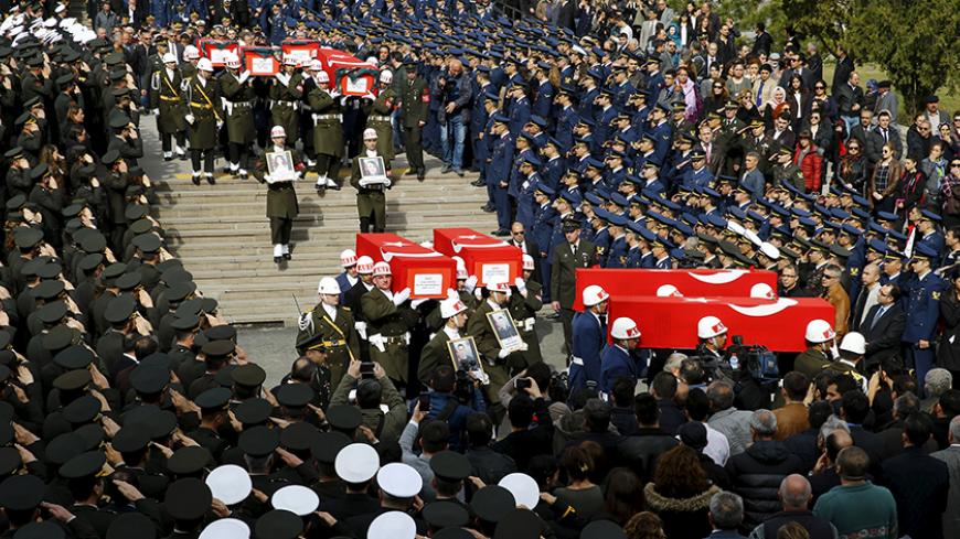 Honour guards carry Turkish flag-draped coffins of car bombing victims during a funeral ceremony at Kocatepe mosque in Ankara, Turkey February 19, 2016. REUTERS/Umit Bektas - RTX27OD3
