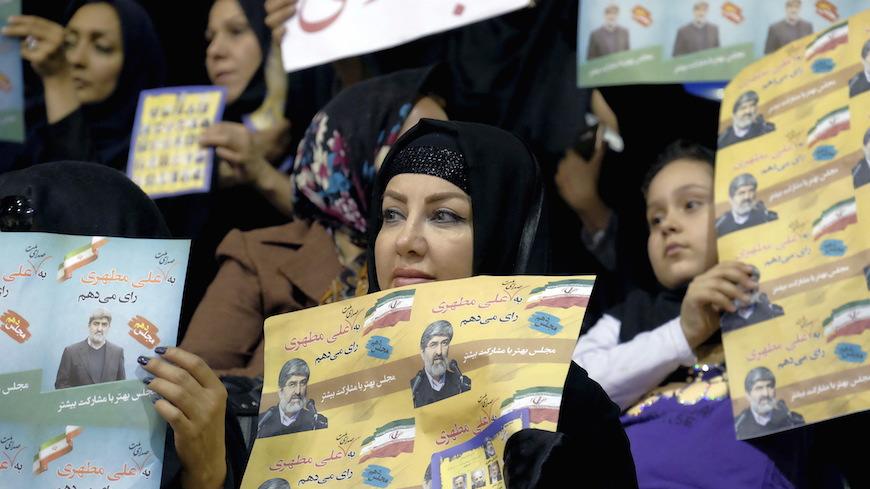 Supporters of Ali Motahari, a candidate for the upcoming parliamentary elections, hold his electoral posters during a campaign gathering of candidates mainly close to the reformist camp, in Tehran February 23, 2016. REUTERS/Raheb Homavandi/TIMAATTENTION EDITORS - THIS IMAGE WAS PROVIDED BY A THIRD PARTY. FOR EDITORIAL USE ONLY.   - RTX287FM