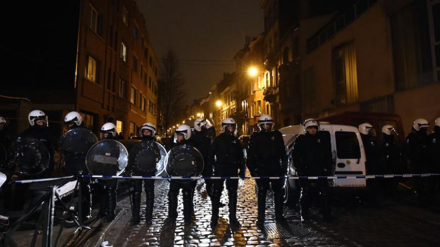 Belgian police forces stand guard in a street during a police action in the Molenbeek-Saint-Jean district in Brussels, on March 18, 2016. A police operation was underway on March 18, in the Brussels area home to key Paris attacks suspect Salah Abdeslam whose fingerprints were found in an apartment raided this week, the federal prosecutor's office said. AFP PHOTO  / JOHN THYS / AFP / JOHN THYS        (Photo credit should read JOHN THYS/AFP/Getty Images)
