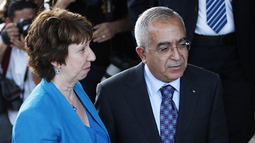 Palestinian Prime Minister Salam Fayyad (R) greets European Union High Representative for Foreign Affairs and Security Policy Catherine Ashton upon her arrival for their meeting in the West Bank city of Ramallah July 17, 2010. 
REUTERS/Mohamad Torokman (WEST BANK - Tags: POLITICS) - RTR2GHYN