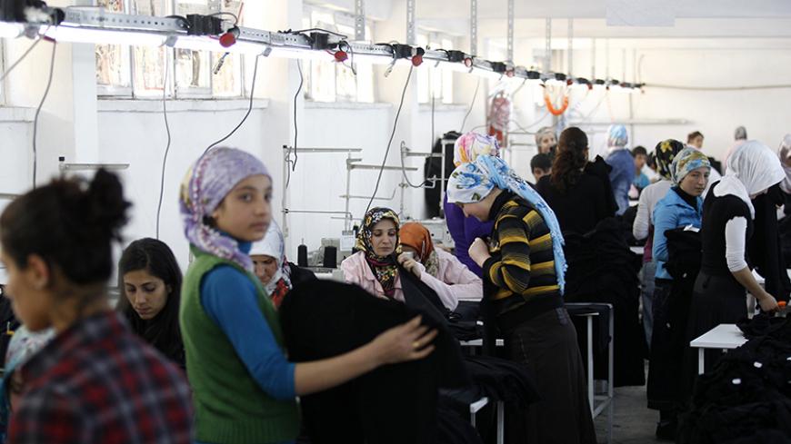 Women work at a textile factory in Kozluk, a town in the southeast province of Batman, April 21, 2011. Since Mehmet Simsek, Turkey's 44-year-old finance minister, left in the mid-1980s to go to Ankara University, his hometown of Batman has become known for incidents of Kurdish militancy and for a high number of unexplained suicides among women and girls. The other great blight on the area is rampant unemployment. Simsek is campaigning for one of Batman's four parliamentary seats in June 12 elections. Pictur