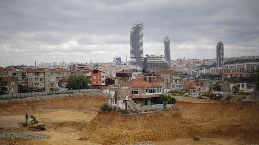 A lone house is seen at a construction site of an urban transformation project in Fikirtepe, an Istanbul neighborhood, in the Asian part of the city, May 7, 2014. The house belongs to a family who has refused to give its approval for the demolishment of the building, bringing the transformation project to a standstill. The owner of the house has demanded a new contract with further guarantees before signing an agreement with the construction firm behind the project, local media reported. REUTERS/Murad Sezer