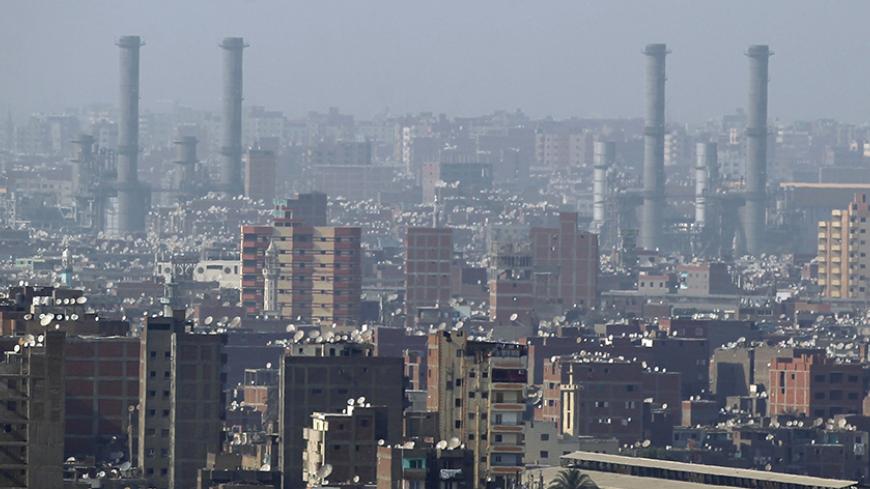 A general view of narrow houses and factories in Cairo May 22, 2014.  Days before a presidential election he seems certain to win, Abdel Fattah al-Sisi released a detailed, colour-coded rendering of "The Map of the Future", designed to reassure Egyptians he is serious about attracting investment in their battered economy. REUTERS/Amr Abdallah Dalsh (EGYPT - Tags: CITYSCAPE POLITICS ELECTIONS BUSINESS) - RTR3QEKP