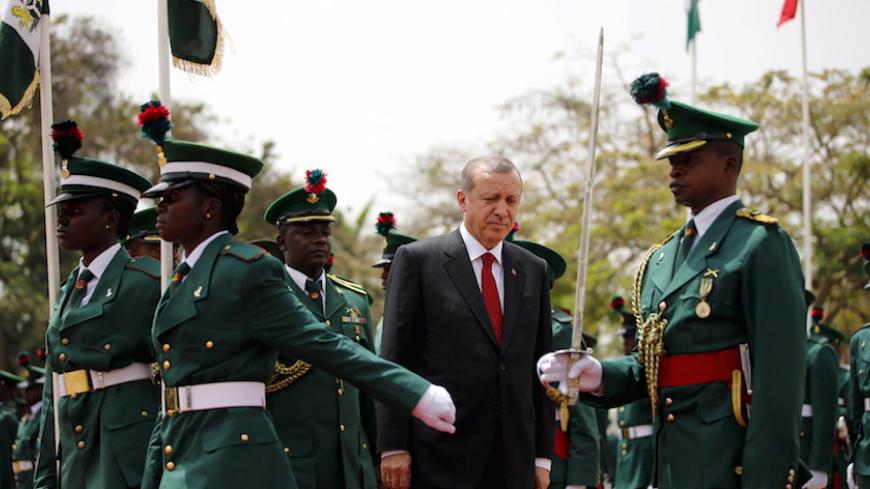 Turkish President Tayyip Erdogan reviews an honor guard during a ceremonial reception in Abuja, Nigeria March 2, 2016 REUTERS/Afolabi Sotunde - RTS8YZO