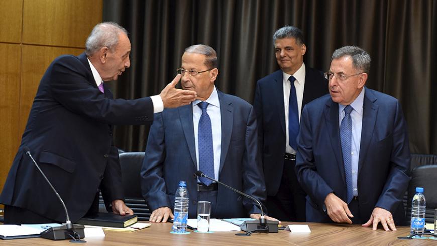 Lebanese Parliament Speaker Nabih Berri (L) speaks with Lebanese Christian leader Michel Aoun (C) and former Prime Minister Fouad Siniora (R) during a session of national dialogue aimed at discussing ways out of a political crisis in downtown Beirut, Lebanon, September 9, 2015. Lebanese security services locked down central Beirut on Wednesday as politicians gathered to discuss ways out of a political crisis that has paralyzed government and fueled a wave of street protests. REUTERS/Hasan Ibrahim/Lebanese P