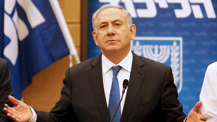 Israel's Prime Minister Benjamin Netanyahu (C) attends a meeting of the Likud party in the Israeli parliament in Jerusalem, March 28, 2016. REUTERS/ Nir Elias - RTSCIM8