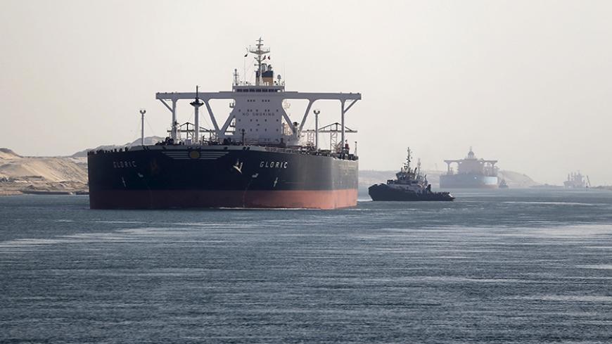 A cargo ship passes through the New Suez Canal in Ismailia, Egypt, January 17, 2016. REUTERS/Mohamed Abd El Ghany - RTX22RWT