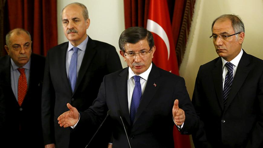 Turkish Prime Minister Ahmet Davutoglu addresses the media in Ankara, Turkey February 20, 2016, as he is flanked by his deputies Tugrul Turkes (L), Numan Kurtulmus (2nd L) and Interior Minister Efkan Ala (R). Turkey is to tighten security across the country, and especially the capital, following a car bombing that killed 28 people in Ankara this week, Davutoglu said on Saturday. REUTERS/Umit Bektas - RTX27U3T