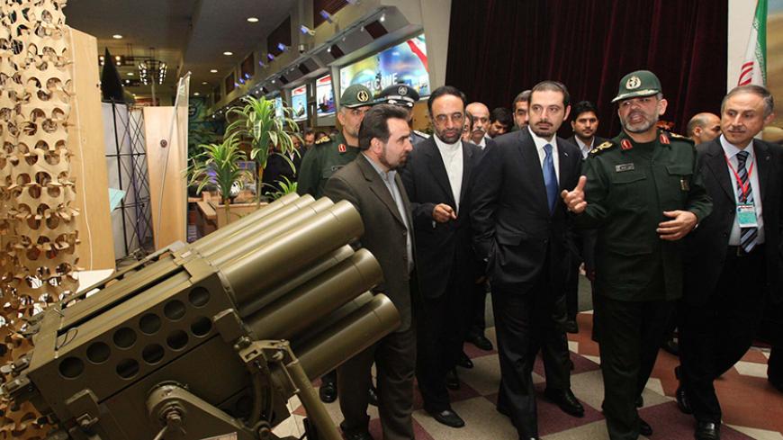 EDITORS' NOTE: Reuters and other foreign media are subject to Iranian restrictions on leaving the office to report, film or take pictures in Tehran.

Lebanese Prime Minister Saad al-Hariri (R) looks at weapons with Iran's Defense Minister Mohammad Najar (2nd R) at a military exhibition in Tehran November 28, 2010. REUTERS/Ministry of Defence/Vahid Reza Alaei/Handout (IRAN - Tags: POLITICS MILITARY) FOR EDITORIAL USE ONLY. NOT FOR SALE FOR MARKETING OR ADVERTISING CAMPAIGNS. THIS IMAGE HAS BEEN SUPPLIED BY A