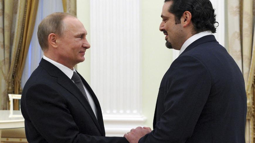 Russia's President Vladimir Putin (L) welcomes Lebanon's former prime minister Saad al-Hariri during a meeting at the Kremlin in Moscow, Russia, April 1, 2016. REUTERS/Michael Klimentyev/Sputnik/Kremlin ATTENTION EDITORS - THIS IMAGE HAS BEEN SUPPLIED BY A THIRD PARTY. IT IS DISTRIBUTED, EXACTLY AS RECEIVED BY REUTERS, AS A SERVICE TO CLIENTS.   - RTSD5XC