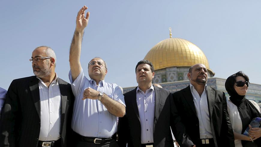 Israeli Arab lawmakers from the Joint Arab List (from L to R) Osama Saadi, Ahmed Tibi, Ayman Odeh, Masud Ganaim and Haneen Zoabi stand in front of the Dome of the Rock during a visit to the compound known to Muslims as Noble Sanctuary and to Jews as Temple Mount in Jerusalem's Old City July 28, 2015. REUTERS/Ammar Awad  - RTX1M321