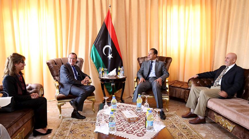United Nations envoy to Libya Martin Kobler (2nd L) waits to meet Aguila Saleh, head of the internationally-recognised Libyan parliament, in Tobruk, Libya, April 18, 2016. REUTERS/Stringer - RTX2AKQX
