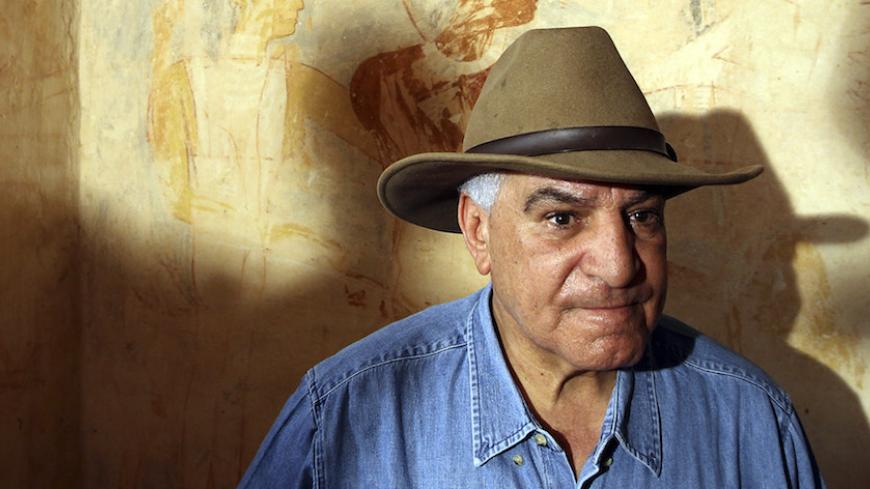 Secretary General of the Supreme Council of Antiquities in Egypt Zahi Hawass speaks to the media inside a newly discovered tomb near the Giza pyramids October 19, 2010. The tomb dates back to the Fifth Dynasty of 2,514 to 2,374 B.C. and belonged to the priest Rwd-ka who conducted prayer rituals before statues of a departed pharaoh.     RETUERS/ Goran Tomasevic  (EGYPT - Tags: SOCIETY) - RTXTL4H