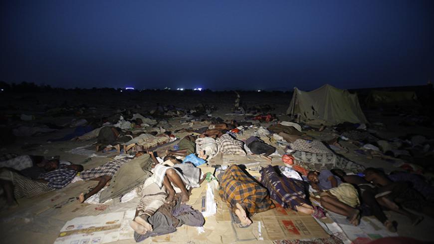 Ethiopian migrants sleep out in the open near a transit centre where they wait to be repatriated, in the western Yemeni town of Haradh, on the border with Saudi Arabia, May 21, 2013. Saudi Arabia's King Abdullah in April ordered a three-month delay to a crackdown on migrant workers which has led to thousands of deportations, to give foreigners in the kingdom a chance to sort out their papers. More than 200,000 foreigners have been deported from the country over the past few months. REUTERS/Khaled Abdullah (