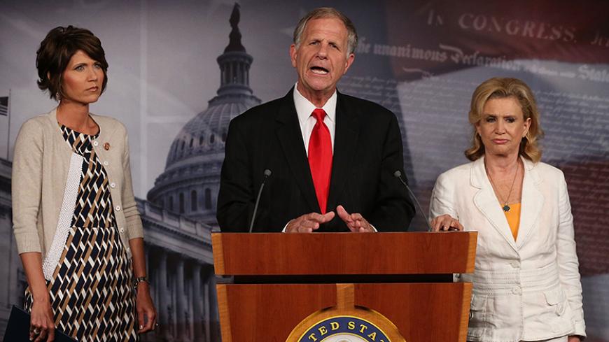 WASHINGTON, DC - AUGUST 01: U.S. Rep.  Ted Poe (R-TX) (C), speaks about the sex slave industry while flanked by (L-R), U.S. Rep.  Carolyn Maloney (D-NY) (R) and U.S. Rep.  Kristi Noem (R-SD) during a news conference on Capitol Hill, August 1, 2013 in Washington, DC. The bi partisan members of Congress discussed a plan to end the sex trafficking trade in the United States.  (Photo by Mark Wilson/Getty Images)