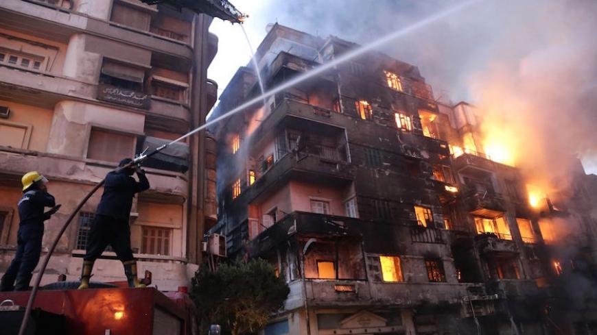 Egyptian firefighters extinguish fire at the popular market area of al-Atabaa in downtown Cairo, on May 9, 2016.
At least 50 people including firefighters suffered minor injuries when a fire spread quickly through a commercial area in downtown Cairo, Egyptian officials said. The fire erupted overnight in a small hotel in the Al-Mosky neighbourhood, not far from the Al-Azhar mosque, and moved rapidly to four nearby buildings, police told AFP. / AFP / AHMED ABD EL-GAWAD        (Photo credit should read AHMED 