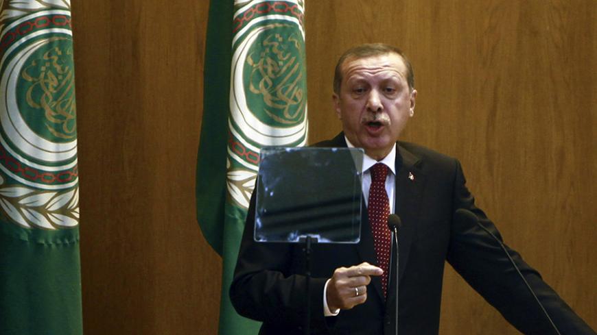 Turkey's Prime Minister Tayyip Erdogan speaks during the opening session of Arab League's foreign ministers meeting at the League headquarters in Cairo September 13, 2011. Erdogan told a meeting of Arab League foreign ministers in Cairo on Tuesday that the recognition of a Palestinian state was "not an option but an obligation". Arab states will push for a fully fledged Palestinian state at the United Nations next week. REUTERS/Amr Abdallah Dalsh  (EGYPT - Tags: POLITICS) - RTR2R8UK