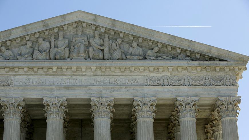 The U.S. Supreme Court is seen in Washington March 29, 2016. The U.S. Supreme Court on Tuesday split 4-4 for the first time in a major case since the death of Justice Antonin Scalia on a conservative legal challenge to a vital source of funds for organized labor, affirming a lower-court ruling that allowed California to force non-union workers to pay fees to public-employee unions. REUTERS/Gary Cameron - RTSCOU4