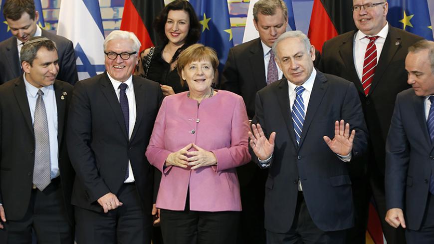 Israeli Prime Minister Benjamin Netanyahu (2R) and German Chancellor Angela Merkel (C) pose for a group picture with their delegations at the Chancellery in Berlin, Germany, February 16, 2016.       REUTERS/Fabrizio Bensch   TPX IMAGES OF THE DAY - RTX275MJ