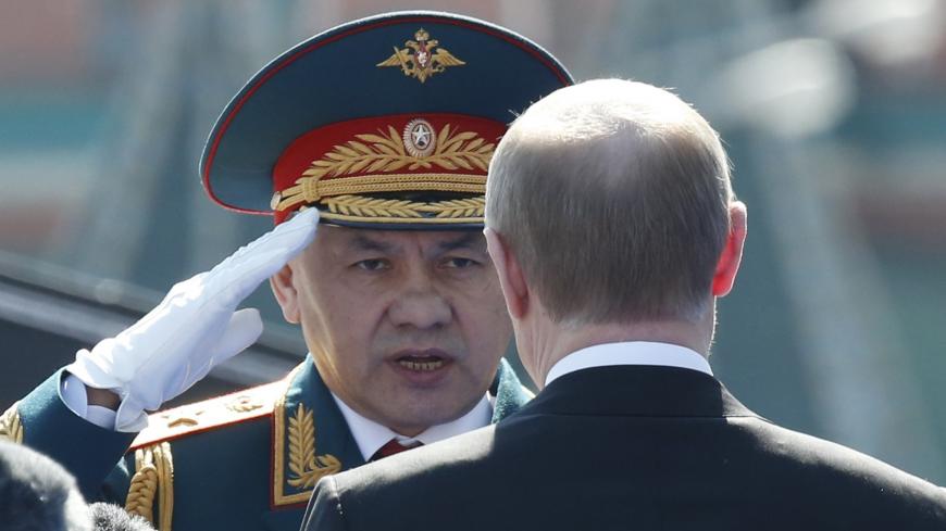Russian President Vladimir Putin (R) and Defence Minister Sergei Shoigu attend the Victory Day parade, marking the 71st anniversary of the victory over Nazi Germany in World War Two, at Red Square in Moscow, Russia, May 9, 2016. REUTERS/Grigory Dukor - RTX2DFS2