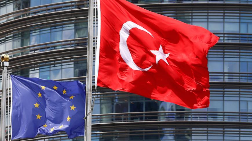European Union (L) and Turkish flags fly outside a hotel in Istanbul, Turkey May 4, 2016. REUTERS/Murad Sezer - RTX2DYBG