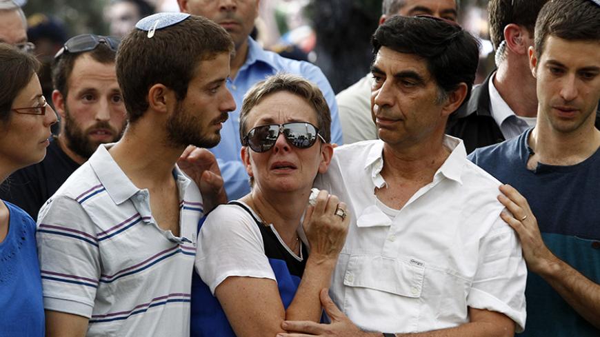 (L-R) Ayelet, Zur, Lea, Simcha and Haimi, the family of Israeli soldier Lieutenant Hadar Goldin mourn during his funeral in Kfar Saba, near Tel Aviv August 3, 2014. An Israeli air strike killed 10 people and wounded about 30 on Sunday in a U.N.-run school in the southern Gaza Strip, a Palestinian official said, as dozens died in Israeli shelling of the enclave and Hamas fired rockets at Israel. The Israeli military said it was looking into the attack, the second to hit a school in less than a week. And amid