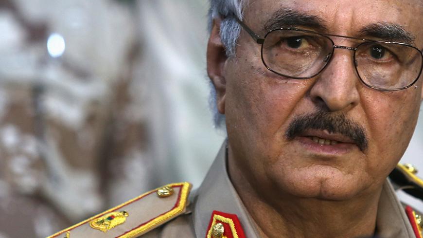 Then-General Khalifa Haftar speaks during a news conference at a sports club in Abyar, east of Benghazi May 21, 2014. Growing frustration over the reality of life in eastern Libya, which contrasts with the promises of politicians, is feeding support for Haftar, who has set himself up as a warrior against Islamist militancy and who some also see as their saviour.  Picture taken May 21, 2014.     REUTERS/Esam Omran Al-Fetori (LIBYA - Tags: CIVIL UNREST POLITICS MILITARY) - RTR4QLUB