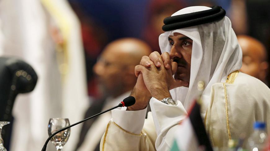 Qatar Sheikh Tamim bin Hamad al Thani attends the opening meeting of the Arab Summit in Sharm el-Sheikh, in the South Sinai governorate, south of Cairo, March 28, 2015. Arab League heads of state are holding a two-day summit to discuss a range of conflicts in the region, including Yemen and Libya, as well as the threat posed by Islamic State militants. REUTERS/Amr Abdallah Dalsh  - RTR4V93X