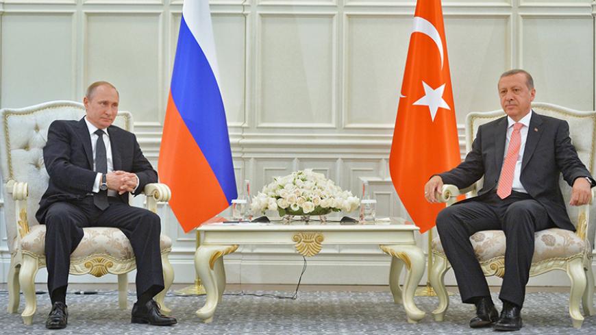 Russia's President Vladimir Putin (L) and Turkey's President Tayyip Erdogan sit next to each other during their meeting in Baku, Azerbaijan, June 13, 2015.  REUTERS/Alexei Druzhinin/RIA Novosti/Kremlin ATTENTION EDITORS - THIS IMAGE HAS BEEN SUPPLIED BY A THIRD PARTY. IT IS DISTRIBUTED, EXACTLY AS RECEIVED BY REUTERS, AS A SERVICE TO CLIENTS. - RTX1GBHP