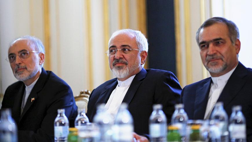 Iranian Foreign Minister Mohammad Javad Zarif (C), Head of the Iranian Atomic Energy Organization Ali Akbar Salehi and Hossein Fereydoon (R), brother and close aide to President Hassan Rouhani meet with U.S. Secretary of State John Kerry (not pictured) at a hotel in Vienna, Austria July 3, 2015. A year and half of nuclear talks between Iran and major powers were creeping towards the finish line on Friday as negotiators wrestled with sticking points including questions about Tehran's past atomic research.  R