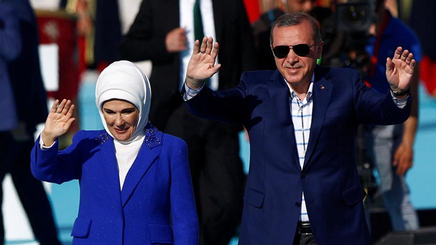 Turkish President Tayyip Erdogan, accompanied by his wife Emine Erdogan, greets supporters during a rally to mark the 563rd anniversary of the conquest of the city by Ottoman Turks, in Istanbul, Turkey, May 29, 2016. REUTERS/Murad Sezer - RTX2ET1L