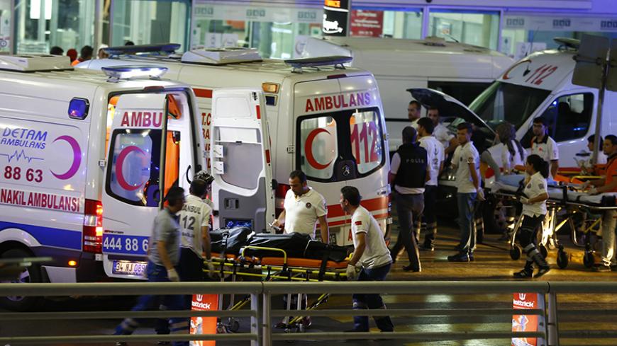 Paramedics push a stretcher at Turkey's largest airport, Istanbul Ataturk, Turkey, following a blast June 28, 2016.     REUTERS/Osman Orsal - RTX2IR3E