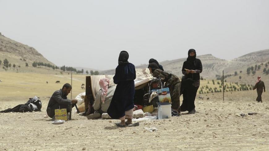 Syrian families, who fled the assault launched by Arab and Kurdish forces against Islamic State (IS) group fighters in the town of Manbij, arrive at an encampment on the outskirts of the town, 20km away from the center, on June 4, 2016.  
Arab and Kurdish fighters backed by Washington have launched an assault on the strategic Manbij pocket further up the Euphrates on the Turkish border, regarded as a key entry point for foreign jihadists.
The Syrian Democratic Forces's offensive against the Manbij pocket is