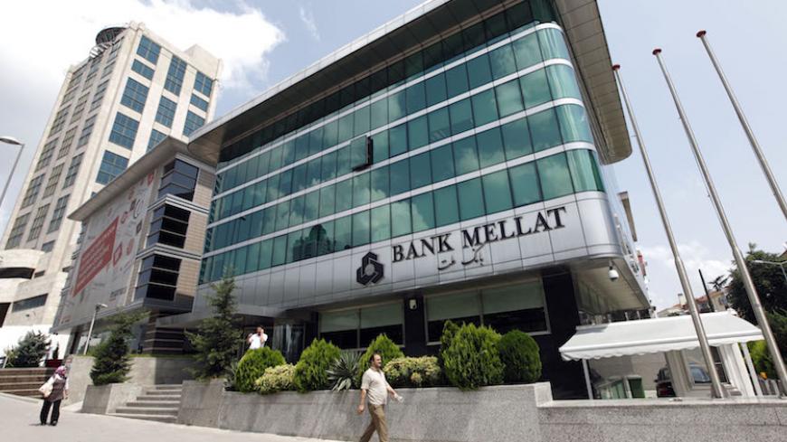 People walk past a branch of Iran's Bank Mellat in Istanbul August 18, 2010. Picture taken  August 18, 2010.       REUTERS/Murad Sezer (TURKEY - Tags: BUSINESS) - RTR2HUBS