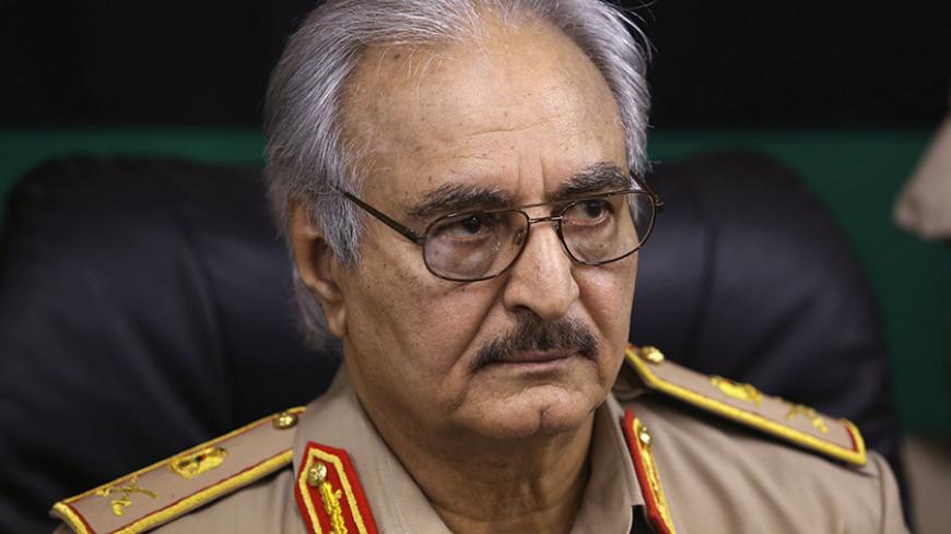 Then-General Khalifa Haftar speaks during a news conference in Abyar, east of Benghazi May 31, 2014. Growing frustration over the reality of life in eastern Libya, which contrasts with the promises of politicians, is feeding support for Haftar, who has set himself up as a warrior against Islamist militancy and who some also see as their saviour.  Picture taken May 31, 2014.  REUTERS/Esam Omran Al-Fetori (LIBYA - Tags: CIVIL UNREST POLITICS MILITARY) - RTR4QLTY