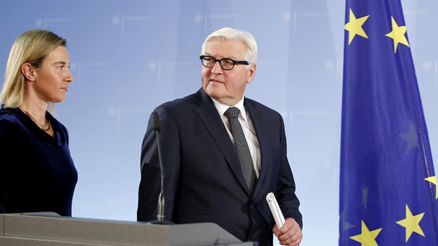 European Union Foreign Policy Chief Federica Mogherini and German Foreign Minister Frank-Walter Steinmeier (R) arrive for a joint news conference at the Foreign Ministry in Berlin, Germany October 22, 2015.The "Quartet" of Middle East peace mediators will meet in Vienna on Friday to urge Israeli and Palestinian leaders to tone down their rhetoric and calm down the situation on the ground, the EU's top diplomat said on Thursday.   REUTERS/Fabrizio Bensch  - RTS5MGB