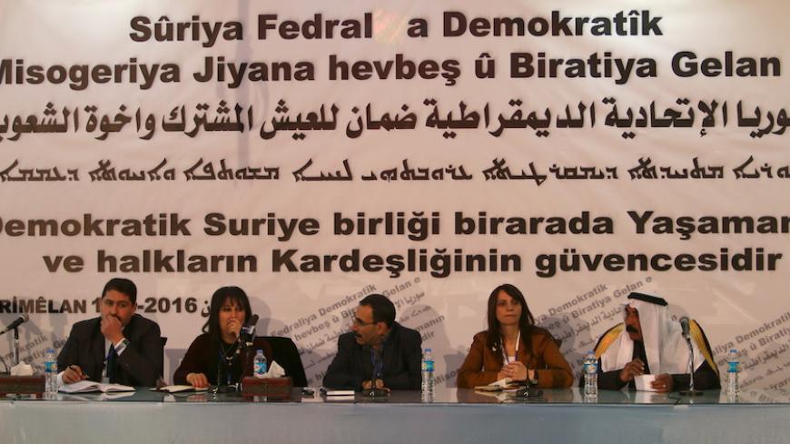Bureau members of a preparatory conference to announce a federal system discuss a "Democratic Federal System for Rojava - Northern Syria" in the Kurdish-controlled town of Rmeilan, Hasaka province, Syria March 16, 2016. REUTERS/Rodi Said - RTSARA8