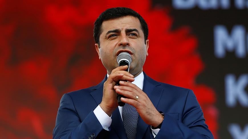 The leader of Turkey's pro-Kurdish opposition Peoples' Democratic Party (HDP) Selahattin Demirtas, makes a speech during a rally in Istanbul, Turkey, June 5, 2016. REUTERS/Osman Orsal - RTSG2V7