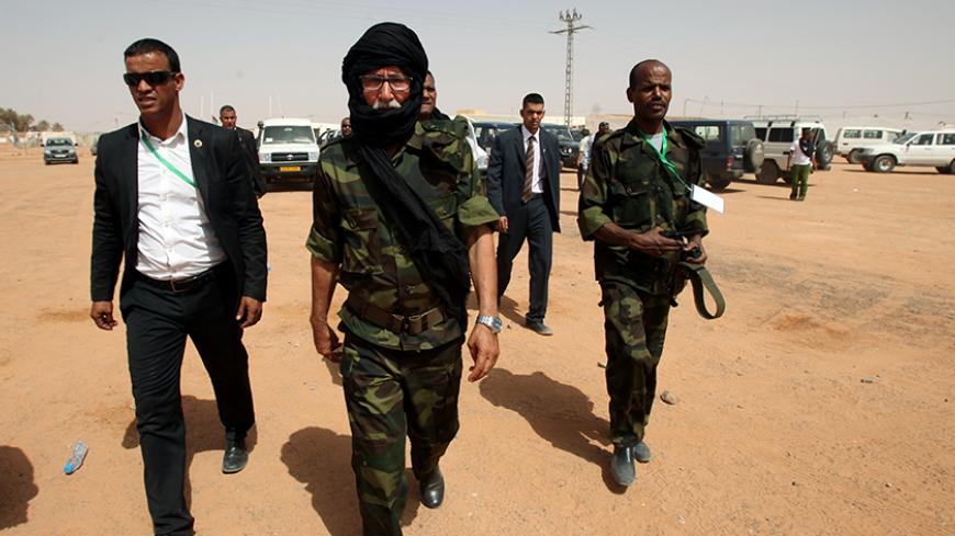 Brahim Ghali (C), new secretary general of Polisario Front and president of the Sahrawi Arab Democratic Republic (SADR), walks at the Sahrawi refugee camp of Dakhla, southeast of the Algerian city of Tindouf, July 9, 2016. REUTERS/Ramzi Boudina? - RTSH3RO